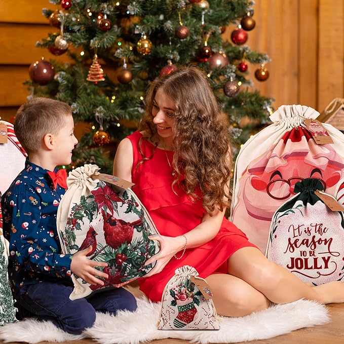 POPGIFTU 12 Pack Christmas Canvas Drawstring Gift Bags — Reusable Fabric Santa Sacks in Mixed Sizes with Kraft Tags for Holiday Present Packaging, Xmas Decorations & Party Favors