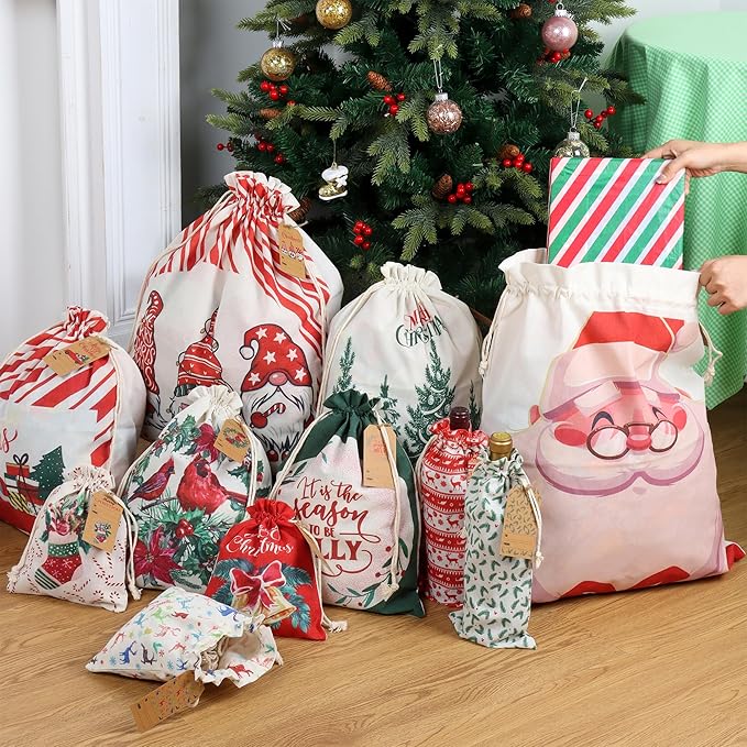 POPGIFTU 12 Pack Christmas Canvas Drawstring Gift Bags — Reusable Fabric Santa Sacks in Mixed Sizes with Kraft Tags for Holiday Present Packaging, Xmas Decorations & Party Favors